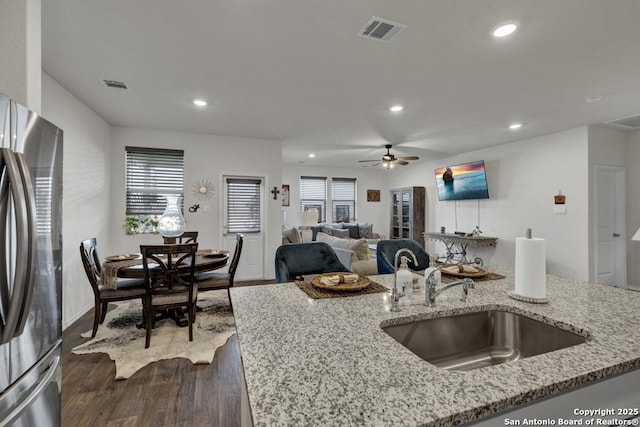 437 Signe, Seguin, TX 78155 - kitchen featuring freestanding refrigerator, a sink, dark wood finished floors, recessed lighting, and open floor plan