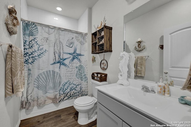 437 Signe, Seguin, TX 78155 - bathroom featuring vanity, toilet, wood finished floors, shower / bath combination with curtain, and recessed lighting