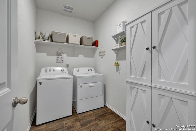 437 Signe, Seguin, TX 78155 - washroom with washer and dryer, dark wood-style floors, and cabinet space