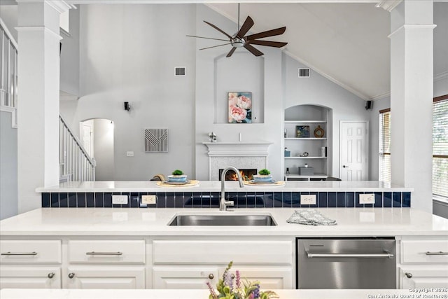 2630 Starlight Ct, San Antonio, TX 78261 - kitchen featuring dishwasher, a sink, ceiling fan, open floor plan, and high vaulted ceiling