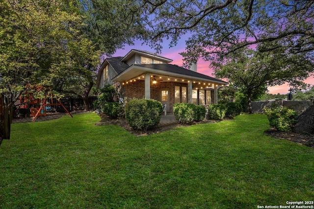 2630 Starlight Ct, San Antonio, TX 78261 - view of side of home with a playground and brick siding