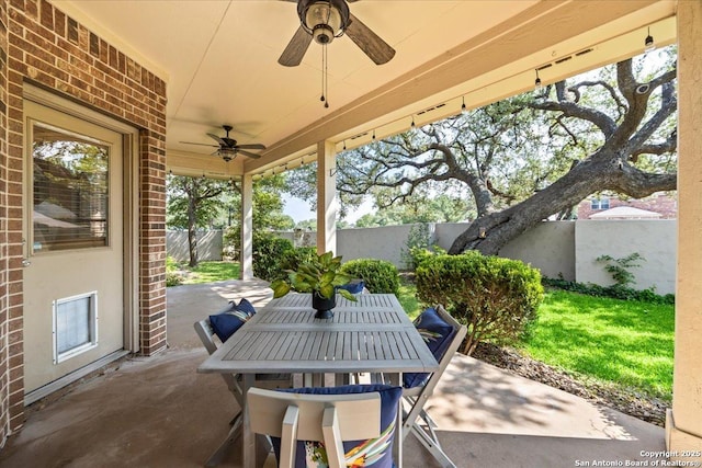2630 Starlight Ct, San Antonio, TX 78261 - fenced backyard featuring a ceiling fan, a patio area, and outdoor dining area