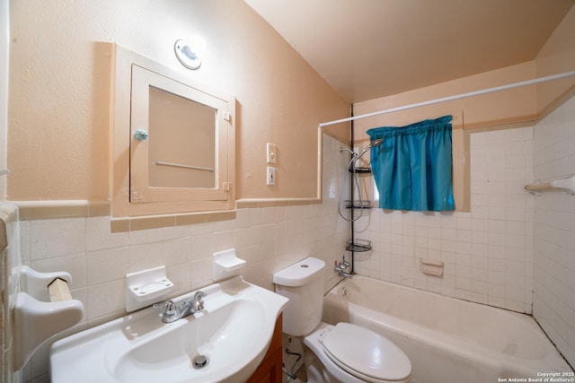 115 Elmo, San Antonio, TX 78225 - bathroom with washtub / shower combination, toilet, vanity, tile walls, and wainscoting