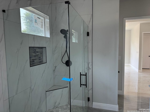15609 Fox Ln, Selma, TX 78154 - bathroom with a marble finish shower and baseboards
