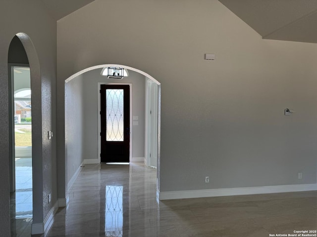 15609 Fox Ln, Selma, TX 78154 - entrance foyer featuring arched walkways, baseboards, and high vaulted ceiling