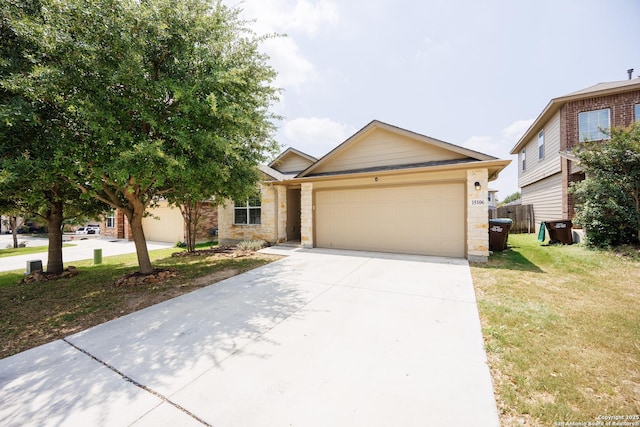 15106 Field Sparrow, San Antonio, TX 78253 - view of front of house featuring an attached garage, driveway, a front yard, and stone siding