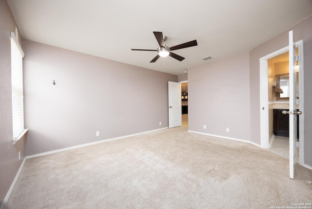 15106 Field Sparrow, San Antonio, TX 78253 - unfurnished bedroom with light colored carpet, baseboards, and ceiling fan