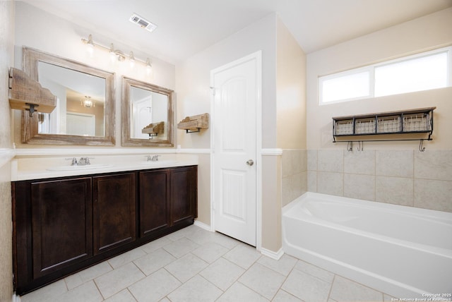 15106 Field Sparrow, San Antonio, TX 78253 - bathroom with tile patterned floors, a garden tub, double vanity, and baseboards