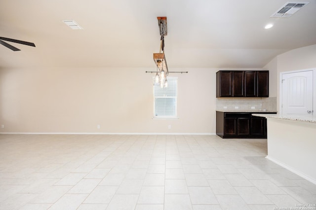 15106 Field Sparrow, San Antonio, TX 78253 - unfurnished living room featuring vaulted ceiling, baseboards, ceiling fan, and recessed lighting