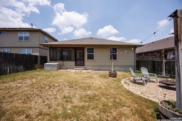 15106 Field Sparrow, San Antonio, TX 78253 - rear view of property with a sunroom, a fire pit, and a shingled roof