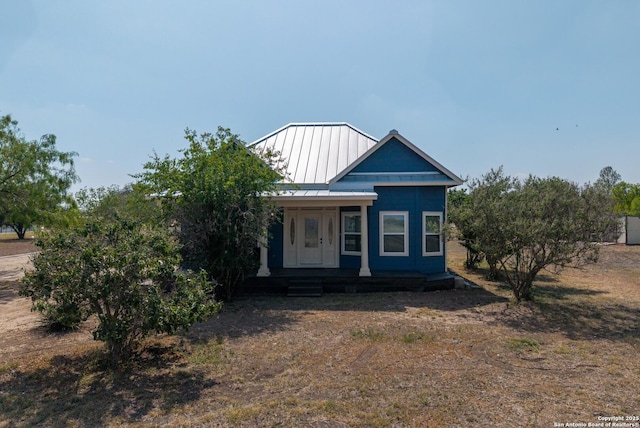 377 County Road 444, Hondo, TX 78861 - view of front of house with a porch, a standing seam roof, and metal roof