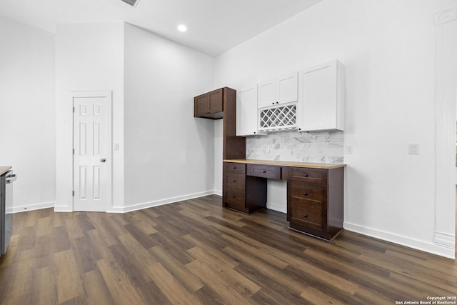 377 County Road 444, Hondo, TX 78861 - unfurnished office featuring dark wood finished floors, built in desk, recessed lighting, and baseboards