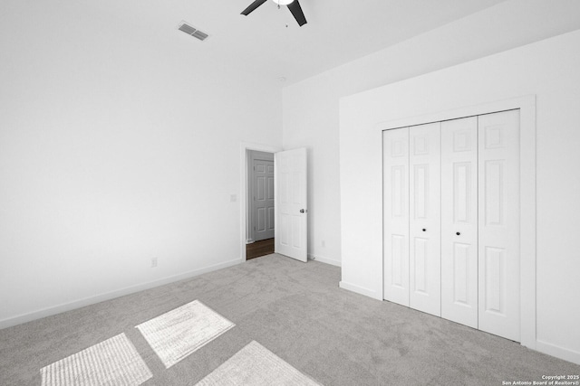 377 County Road 444, Hondo, TX 78861 - unfurnished bedroom with carpet, baseboards, a closet, and a ceiling fan