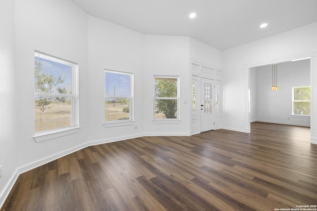 377 County Road 444, Hondo, TX 78861 - unfurnished living room featuring dark wood finished floors, baseboards, and recessed lighting
