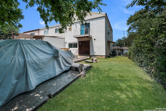1230 Churing, San Antonio, TX 78245 - view of grassy yard with a balcony