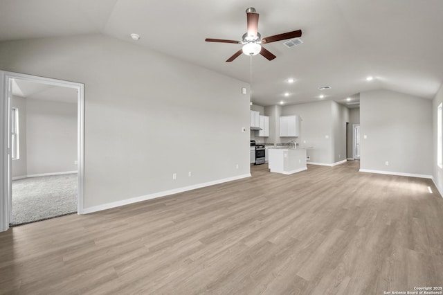 4267 Winston Way, New Braunfels, TX 78130 - unfurnished living room featuring lofted ceiling, a ceiling fan, baseboards, light wood-style flooring, and recessed lighting