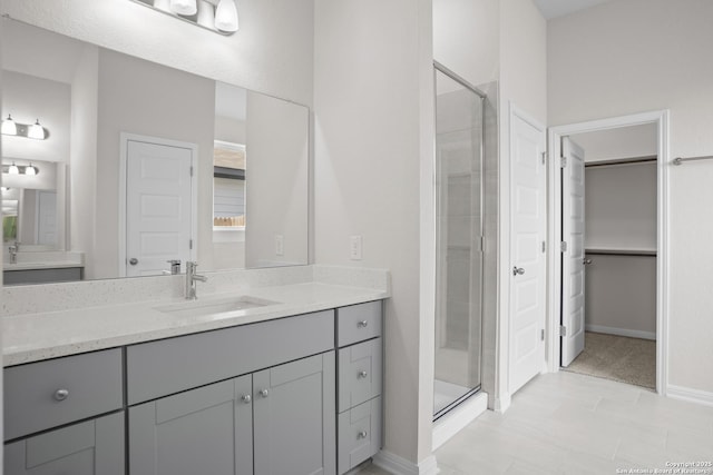 13442 Cosette Xing, San Antonio, TX 78253 - bathroom featuring a stall shower, vanity, baseboards, and tile patterned floors