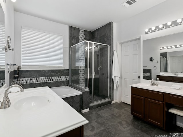 627 Midway, San Antonio, TX 78258 - full bathroom featuring two vanities, a shower stall, and a garden tub