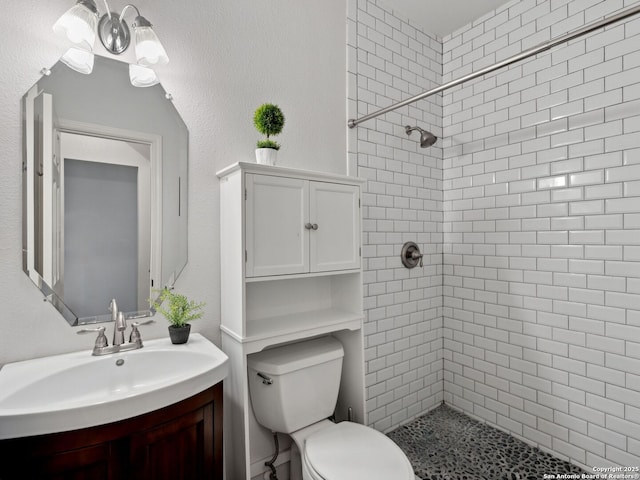 627 Midway, San Antonio, TX 78258 - full bath with a tile shower, vanity, and toilet