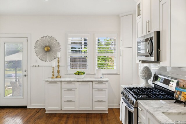 418 Eleanor, San Antonio, TX 78209 - kitchen featuring appliances with stainless steel finishes, dark wood-type flooring, and white cabinets