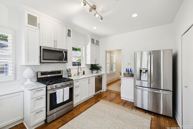 418 Eleanor, San Antonio, TX 78209 - kitchen featuring stainless steel appliances, white cabinetry, decorative backsplash, dark wood-style floors, and recessed lighting