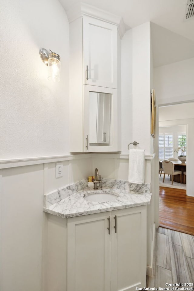 418 Eleanor, San Antonio, TX 78209 - bar featuring a sink and light wood-style floors