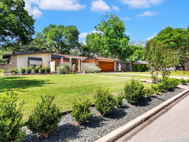 134 Camellia Way, San Antonio, TX 78209 - view of front facade with stucco siding, a standing seam roof, an attached garage, a front yard, and a chimney
