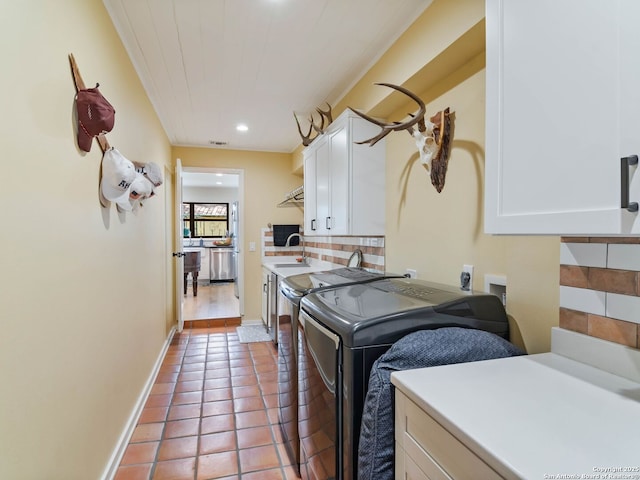 134 Camellia Way, San Antonio, TX 78209 - laundry area with cabinet space, separate washer and dryer, light tile patterned floors, recessed lighting, and baseboards