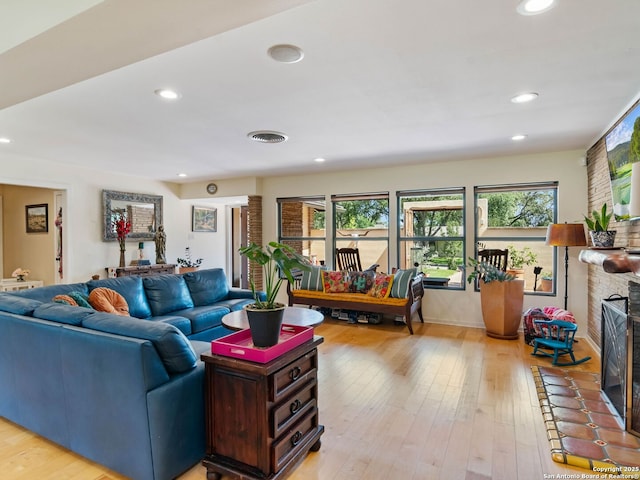 134 Camellia Way, San Antonio, TX 78209 - living room with healthy amount of natural light, recessed lighting, light wood-style floors, and a fireplace