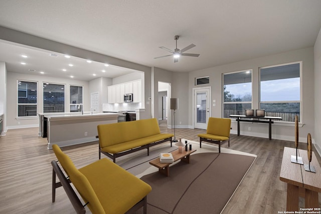 318 Glenwood Rnch, Cibolo, TX 78108 - living room featuring ceiling fan, light wood-type flooring, baseboards, and recessed lighting