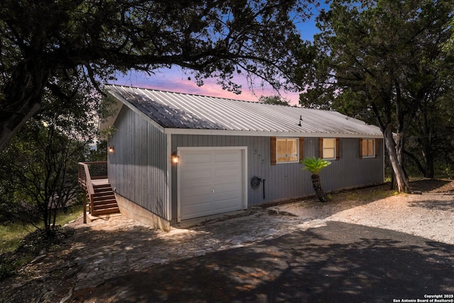 577 Dusty Saddle, Canyon Lake, TX 78133 - view of front of house with stairs, driveway, and metal roof