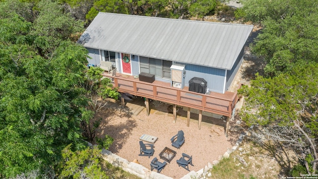577 Dusty Saddle, Canyon Lake, TX 78133 - view of front of home with a wooden deck and metal roof