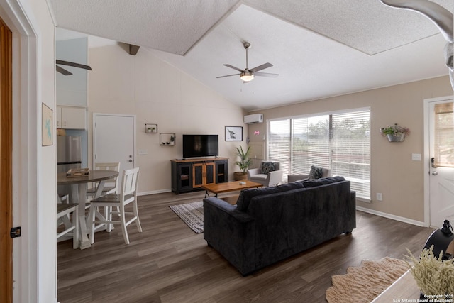 577 Dusty Saddle, Canyon Lake, TX 78133 - living room with a ceiling fan, a wall unit AC, dark wood-style flooring, baseboards, and high vaulted ceiling