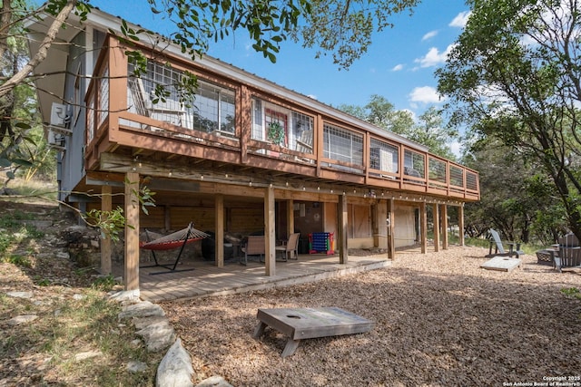 577 Dusty Saddle, Canyon Lake, TX 78133 - rear view of house with a patio area and a wooden deck