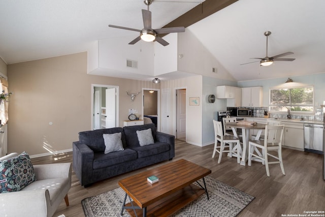 577 Dusty Saddle, Canyon Lake, TX 78133 - living room featuring ceiling fan, wood finished floors, high vaulted ceiling, and baseboards