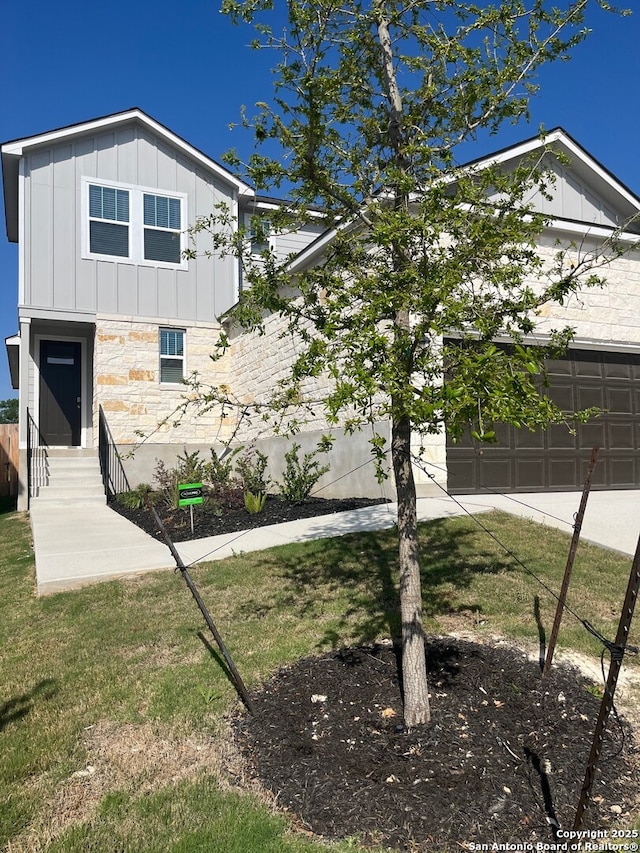 759 Fort Leonard, San Antonio, TX 78245 - view of front of house featuring board and batten siding, entry steps, stone siding, a garage, and a front lawn