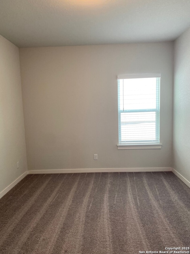 759 Fort Leonard, San Antonio, TX 78245 - unfurnished room featuring dark carpet and baseboards