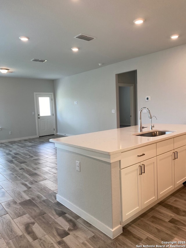 759 Fort Leonard, San Antonio, TX 78245 - kitchen with a sink, open floor plan, light countertops, a kitchen island with sink, and recessed lighting
