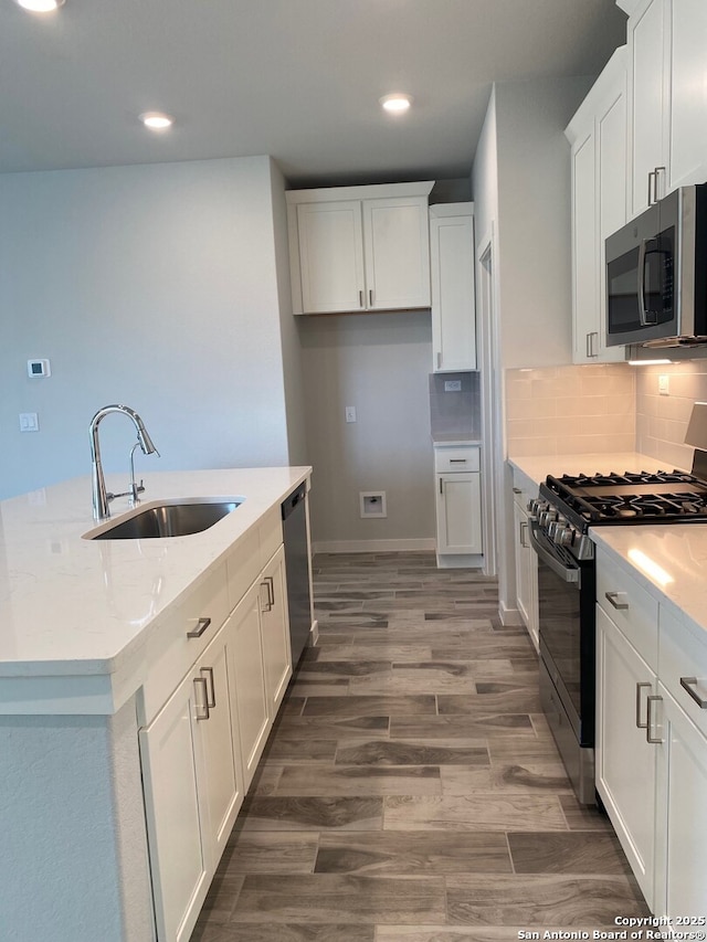 759 Fort Leonard, San Antonio, TX 78245 - kitchen featuring stainless steel appliances, a sink, white cabinets, recessed lighting, and decorative backsplash