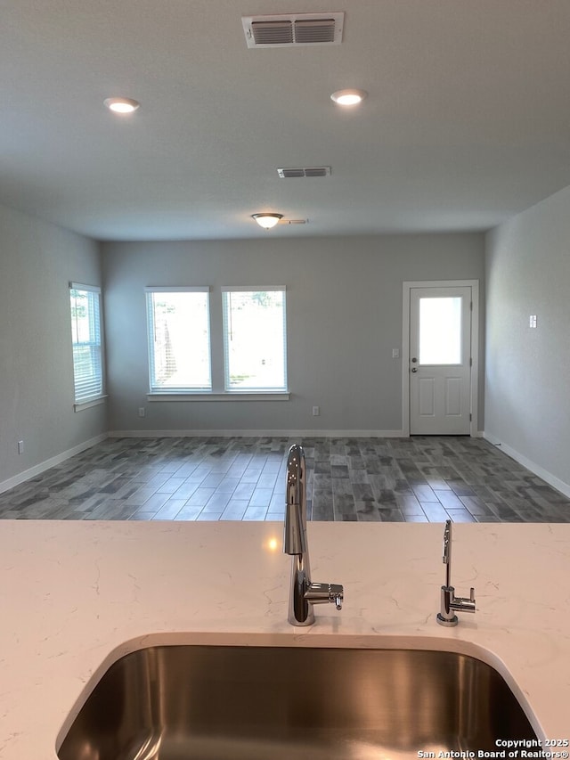 759 Fort Leonard, San Antonio, TX 78245 - kitchen with a sink, healthy amount of natural light, wood finished floors, recessed lighting, and baseboards
