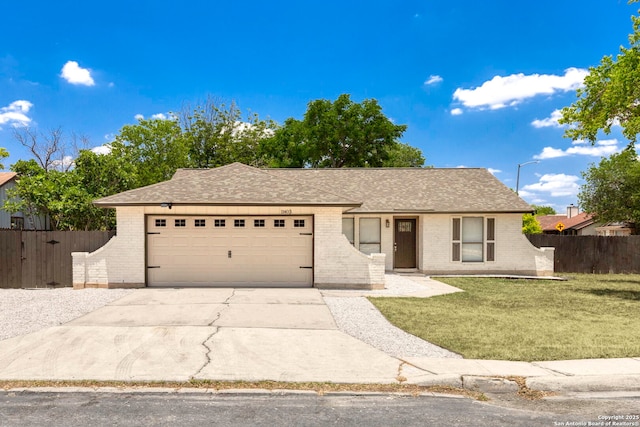 11403 Big Elk, San Antonio, TX 78245 - ranch-style house featuring a garage, brick siding, driveway, and a shingled roof