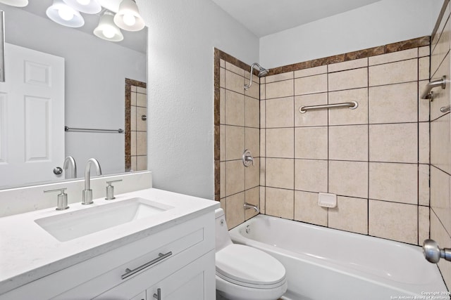 11403 Big Elk, San Antonio, TX 78245 - full bath with a textured wall, toilet, vanity, and shower / washtub combination
