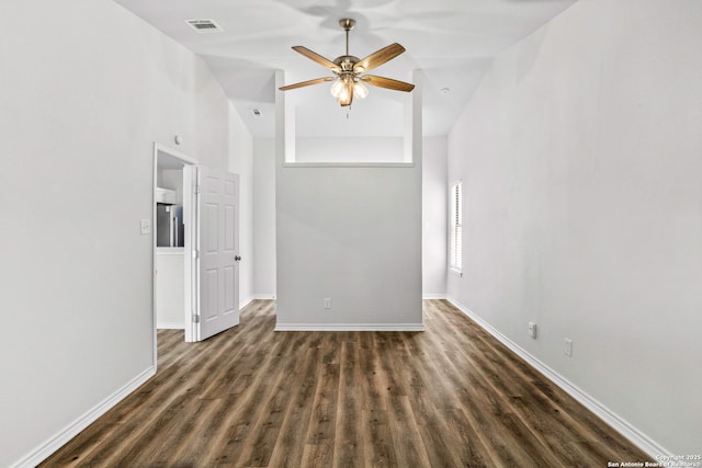 11403 Big Elk, San Antonio, TX 78245 - empty room with dark wood-style flooring, ceiling fan, baseboards, and high vaulted ceiling