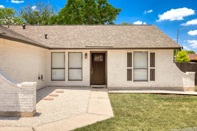 11403 Big Elk, San Antonio, TX 78245 - view of front facade with a shingled roof and brick siding