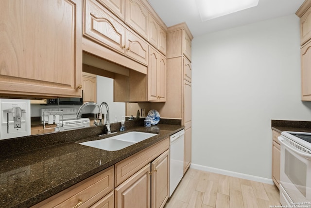 1 Towers Park Ln Unit 1108, San Antonio, TX 78209 - kitchen featuring white appliances, a sink, light brown cabinetry, and dark stone countertops