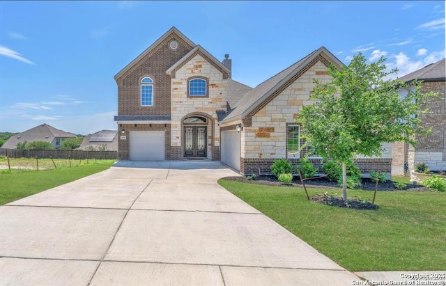 2818 Tortuga Verde, San Antonio, TX 78245 - french country style house featuring driveway, stone siding, brick siding, french doors, and a chimney
