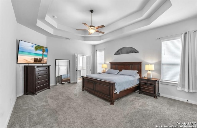 2818 Tortuga Verde, San Antonio, TX 78245 - carpeted bedroom featuring a raised ceiling, baseboards, and a ceiling fan