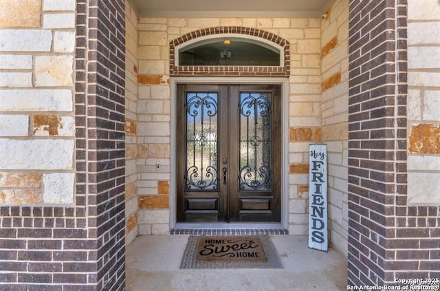2818 Tortuga Verde, San Antonio, TX 78245 - view of exterior entry with brick siding and french doors