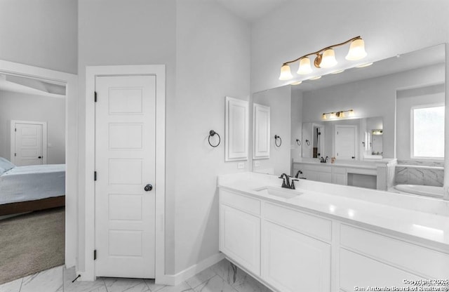 2818 Tortuga Verde, San Antonio, TX 78245 - ensuite bathroom with marble finish flooring, vanity, a tub to relax in, and baseboards