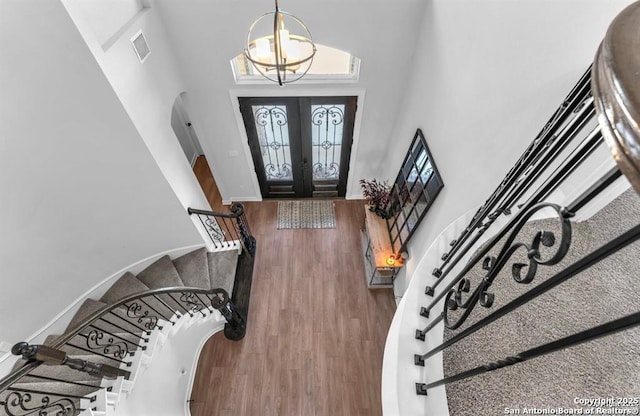 2818 Tortuga Verde, San Antonio, TX 78245 - entryway featuring stairway, french doors, wood finished floors, a high ceiling, and baseboards